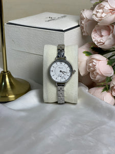 KIMIO watch for ladies with white premium dial and silver chain .