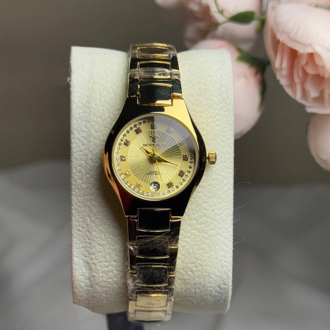 Sophisticated gold-tone dial with crystal hour markers.