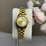 ROLEX Gold dial with a crystal-studded bezel for a glamorous appeal.